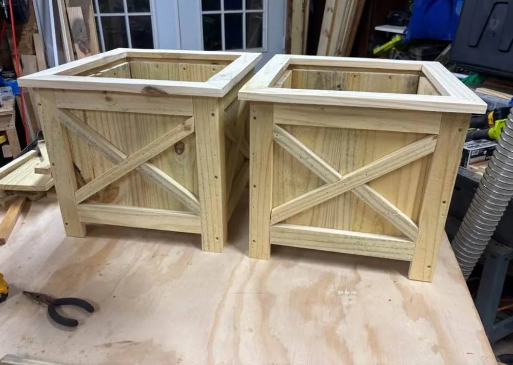 Two farm-style X-brace planter boxes in pressure-treated lumber